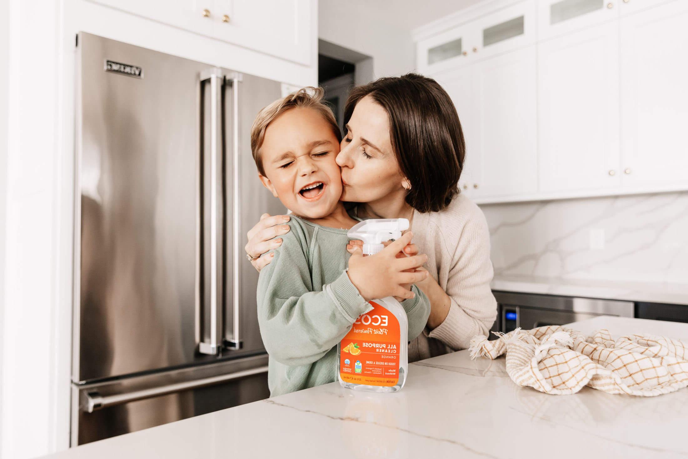 Woman and her child with ECOS cleaner